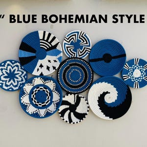 May include: A collection of nine woven wall baskets in various sizes and patterns. The baskets feature a color palette of blue, black, and white, with geometric and spiral designs. The text "BLUE BOHEMIAN STYLE" is at the top.
