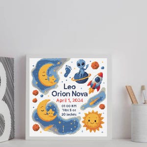 May include: A framed, cross-stitch style artwork featuring a space theme. The design includes a crescent moon, stars, a rocket, an alien, and the text "Leo Orion Nova, April 1, 2024, 7lbs 5 oz, 20 inches". The color palette includes blue, orange, and yellow.