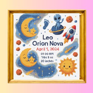 May include: A framed cross-stitch featuring a celestial theme with a moon, stars, and a smiling sun. The design includes a rocket, an alien, and the name "Leo Orion Nova" with birth details: April 1, 2024, 7lbs 5 oz, and 20 inches.