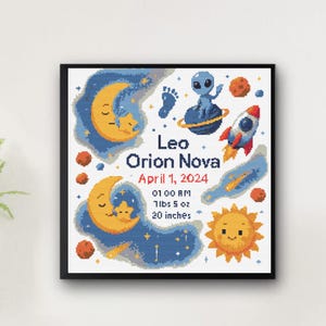 May include: Cross-stitch artwork in a black frame featuring a celestial theme. The design includes a crescent moon, stars, a rocket, an alien, and the text "Leo Orion Nova April 1, 2024". The artwork also includes the baby's birth details: 7lbs 5 oz, 20 inches.