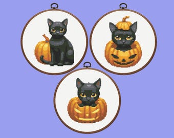 May include: Three cross-stitch hoops featuring black cats and pumpkins. One cat sits beside a pumpkin, another is inside a carved pumpkin, and the third is in a pumpkin. The hoops have a wooden frame and a metal hanging loop.