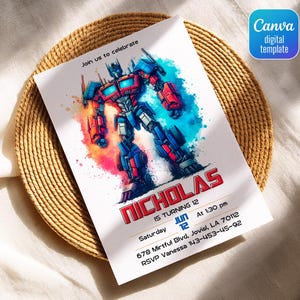 May include: A white invitation card featuring a colorful illustration of a robot character. The card includes the text "Join us to celebrate" and details for a birthday party, including the name "Nicholas", date, time, and location. The card is on a woven placemat.