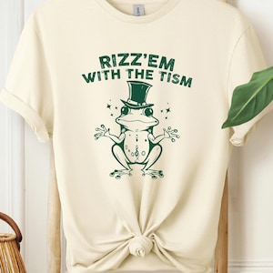 Rizz Em With The Tism Funny Humor T-Shirt, Funny Animal Graphic T-Shirt, Autism Awareness Sweatshirt, Frog Meme, Funny Gift For Women & Men