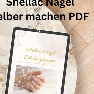 May include: A digital tablet displaying a document titled "Shellac-Nägel Schulungsmappe" with a photo of a hand with pink nail polish and flowers.