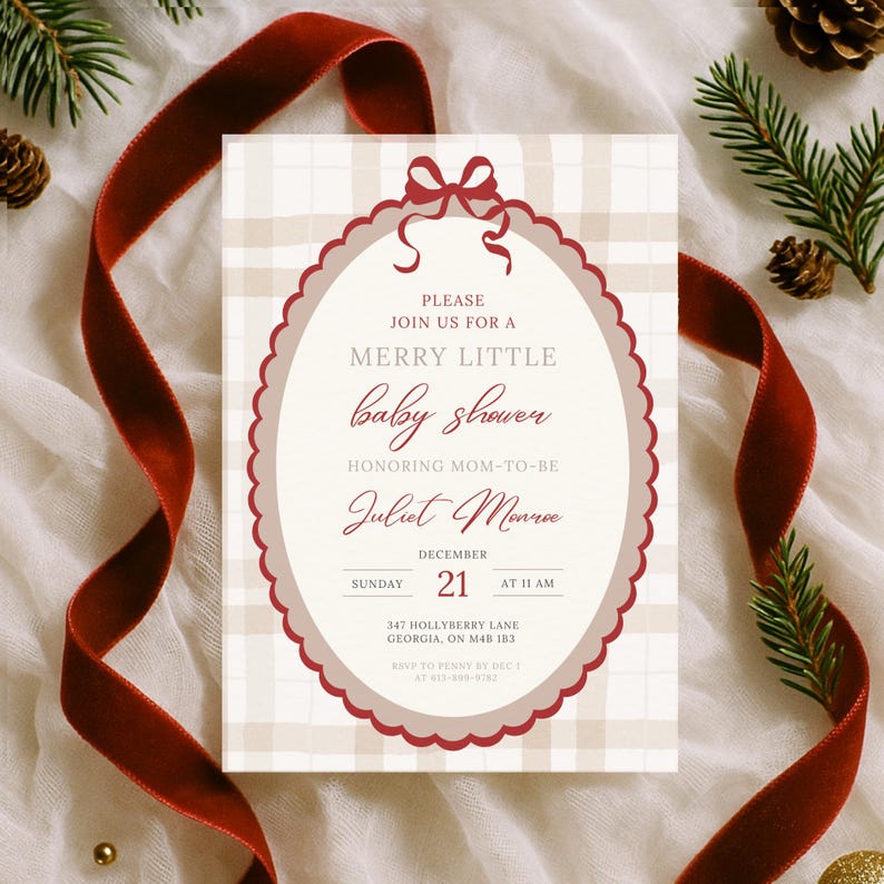May include: A baby shower invitation with a cream and tan plaid background. The invitation has a burgundy scalloped oval frame with the text "MERRY LITTLE baby shower" and details for the event. A burgundy ribbon and pine sprigs decorate the scene.