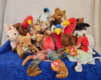 Beanie Baby that have Different Tags and Bottom Tag Dates including Whisper Early Gobbles Claude Goochy Jabber Valentino Slippery and More