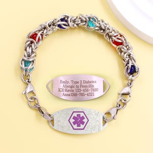 May include: A silver medical ID bracelet with a woven chain design and colorful beads. The bracelet includes two ID tags, one with a purple medical symbol and the other with medical information: Emily, Type 2 Diabetes, Allergic to Penicillin, ICE: Kevin 123-456-7890, Anna: 098-765-4321.