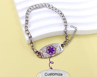 May include: A silver medical alert bracelet with a rhinestone chain and a decorative ID plate. The plate features a purple medical symbol and scrollwork. The text "Customize your Text" is below the bracelet.