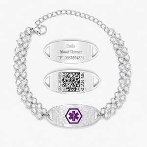 May include: A silver-toned medical alert bracelet featuring a chain of clear, sparkling stones. The central oval plaque displays a purple Star of Life emblem. Two additional oval plaques show engraved text: Emily, Blood Thinner, TEI:0987654321, and a QR code with the text HEALTH INFO SCAN ME.