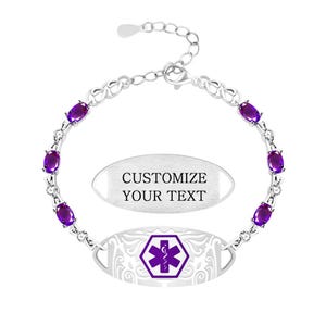 May include: A silver medical alert bracelet featuring oval purple gemstones and clear accent stones. The central oval plate displays a purple Star of Life symbol with a staff and snake. A separate oval plate shows the text CUSTOMIZE YOUR TEXT.