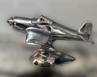 Encendedor de mesa con forma de avión antiguo