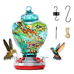 May include: A glass hummingbird feeder with a multi-colored swirl pattern in shades of blue, green, yellow, and red. The base is silver with red flower-shaped feeding ports. Included are a black metal hook, an S-hook, a small brush, and twine.