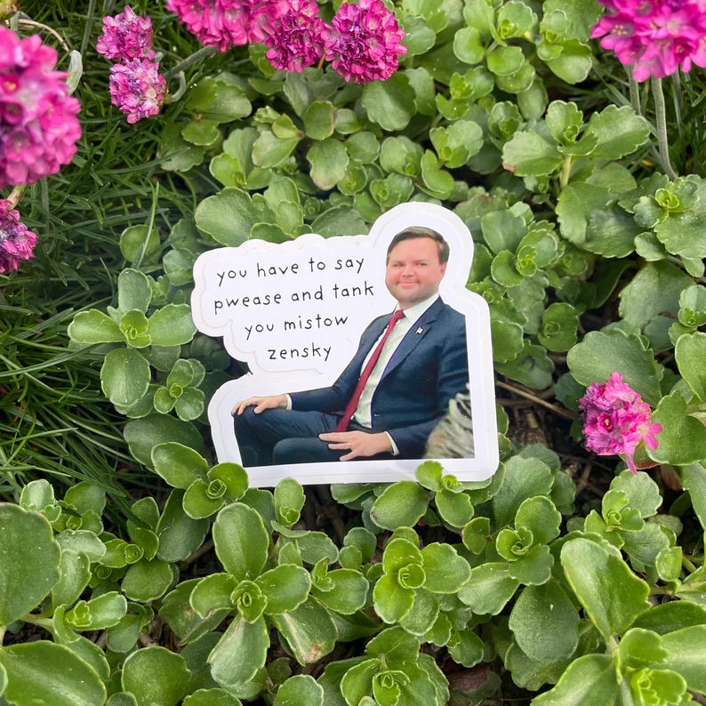 May include: A white sticker with a man in a suit and tie sitting in a chair. The sticker has text that reads "you have to say pwease and tank you mishow zensky".