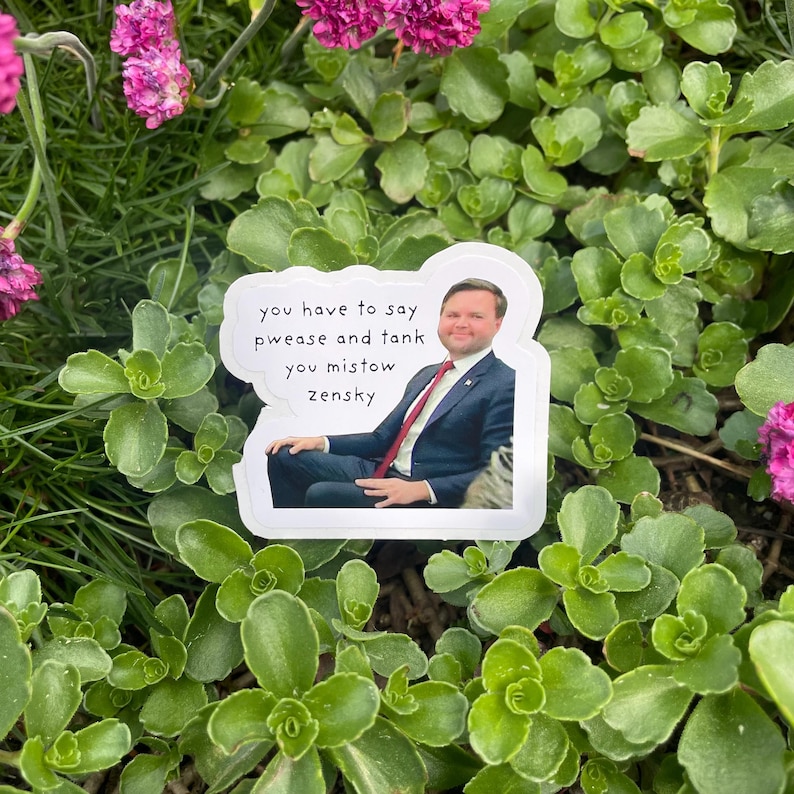 May include: A white sticker with a photo of a man in a suit and tie. The text on the sticker reads "you have to say pwease and tank you mistow zensky".
