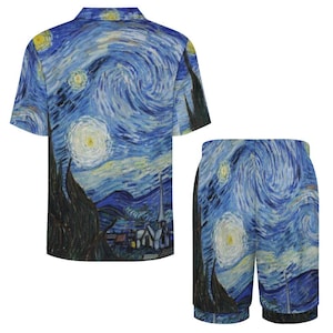 May include: A two-piece pajama set featuring a print of Van Gogh's "Starry Night." The set includes a short-sleeved button-down shirt and matching shorts. The design showcases swirling blue, yellow, and white brushstrokes, with dark tree silhouettes.