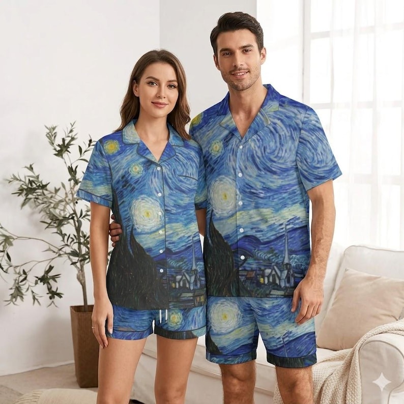 May include: Matching pajama sets featuring a print of Van Gogh's "Starry Night" painting. The sets include a short-sleeved button-down shirt and shorts. The color palette is dominated by blues, yellows, and blacks, with a swirling, textured appearance.