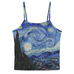 May include: A camisole top featuring a print of Vincent van Gogh's "The Starry Night." The design showcases a swirling blue night sky with prominent stars, a dark tree, and a village. The top has thin straps.