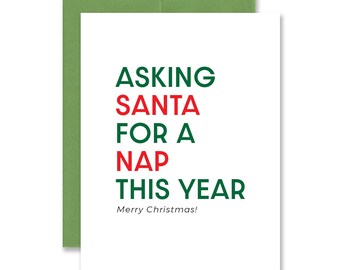 May include: A white Christmas card with green and red text that reads "Asking Santa for a Nap This Year" and "Merry Christmas!"