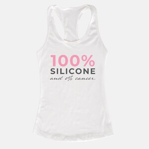 May include: White tank top with the text "100% Silicone and 0% cancer" in pink and black lettering.