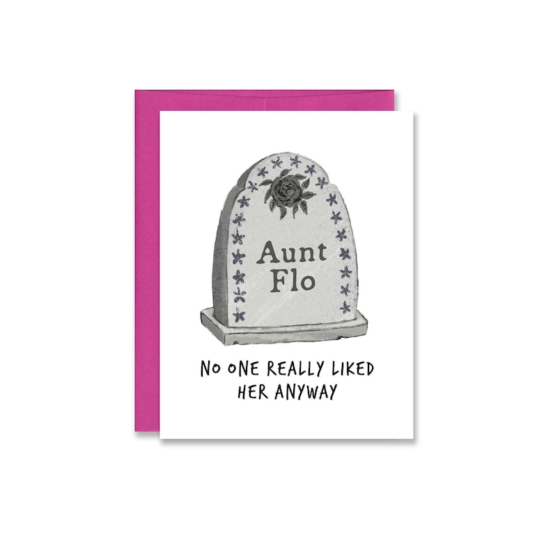 A white card featuring an illustration of a gravestone that reads "Aunt Flo." Beneath it it reads, "No one really liked her anyway." Paired with a bright pink envelope.