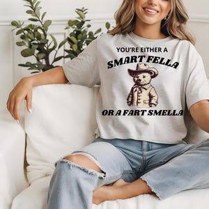 Smart Fella or Fart Smella T-Shirt - Funny Cowboy Bear Shirt, Witty Graphic Tee, Sarcastic Unisex T-Shirt, Vintage Aesthetic Humor Gift