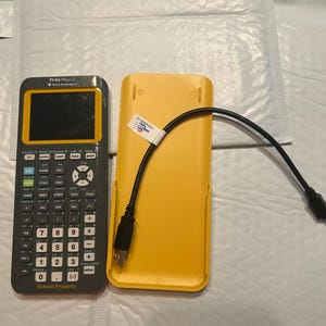 May include: A yellow and black TI-84 Plus CE graphing calculator with a black and white screen. The calculator is in a yellow case with a black USB cable.