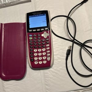 May include: A pink and white TI-84 Plus C Silver Edition graphing calculator with a black case and a USB cable. The calculator screen displays "Error".