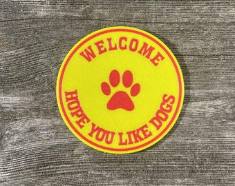 Round Welcome Hope You Like Dogs Pets Warning Sign In Vibrant Yellow With Red Lettering Highly Visible Indoor Outdoor