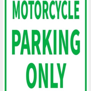 May include: A rectangular white sign with a green border and the words "MOTORCYCLE PARKING ONLY" in large green letters. The sign has two small, silver-coloured rivets at the top and bottom.