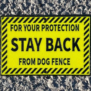 Pour votre protection, ne vous approchez pas des clôtures pour chiens