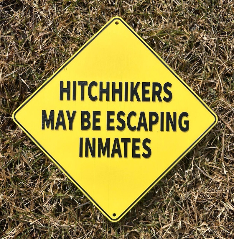 Hitchhikers May Be Escaping Inmates Street Traffic Sign in Vibrant ...