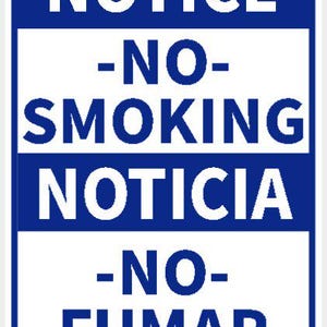 May include: A rectangular blue and white sign with the words "NOTICE -NO- SMOKING NOTICIA -NO- FUMAR" in white text. The sign has rounded corners and is secured with four silver rivets.