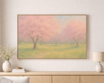 Peut inclure: Impression d'art encadrée représentant un paysage doux de cerisiers en fleurs dans un champ. L'œuvre d'art utilise une palette de couleurs pastel de rose, vert et bleu, avec un cadre doré.