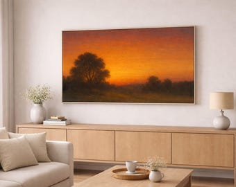 Peut inclure: Peinture de paysage encadrée représentant un coucher de soleil avec un ciel orange et jaune. Une silhouette de grand arbre à gauche, avec des arbres plus petits et un champ au premier plan. L'œuvre est accrochée au-dessus d'un meuble en bois.
