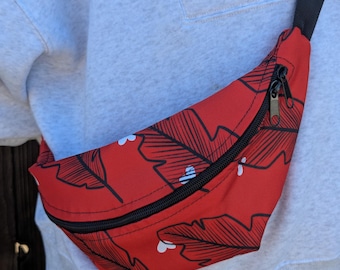 Riñonera estampada con sublimación de fondo de color brillante con dibujo de boceto de plumas
