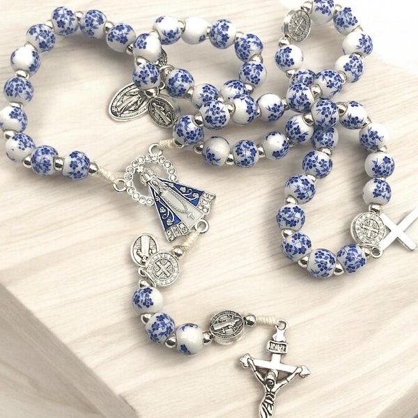 Rosary of blue flower beads with the Virgin of Guadalupe.
