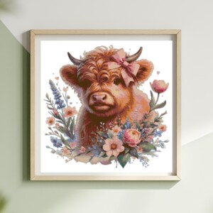 May include: A framed watercolor print of a Highland cow with a pink bow on its head, surrounded by flowers. The artwork features a brown cow with small horns and a soft, fluffy coat. The flowers include pink roses and other blooms.