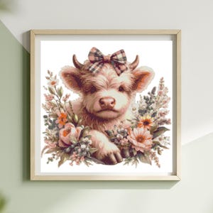 May include: A framed print of a Highland cow calf illustration. The calf has a pinkish-brown coat and a plaid bow. It is surrounded by pink, orange, and white flowers. The frame is a light wood colour, suitable for a nursery or farmhouse decor.