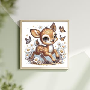 May include: A framed print depicting a cartoon fawn with brown spots, large eyes, and a cheerful expression. The fawn is surrounded by daisies and butterflies in shades of orange, brown, and blue. The artwork is set against a white background.