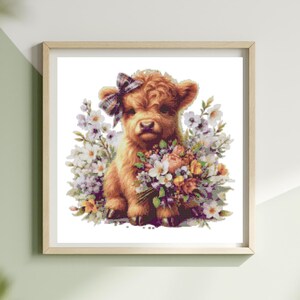 May include: A framed print of a Highland calf illustration. The calf has brown fur and a plaid bow, surrounded by white, purple, and orange flowers. The frame is light wood. The artwork is a watercolor painting.