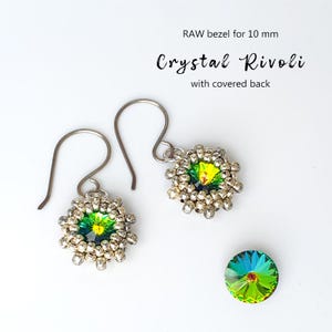 May include: Silver dangle earrings with a crystal rivoli design. Each earring has a central green and yellow crystal, encircled by small silver beads. A loose crystal rivoli is also shown. Text reads: "RAW bezel for 10 mm Crystal Rivoli with covered back."
