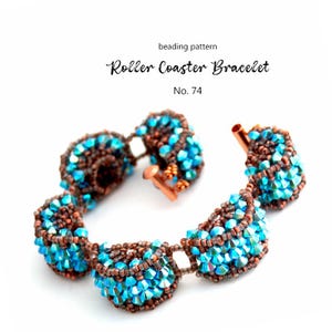 May include: A beaded bracelet with a roller coaster design. The bracelet features turquoise and brown beads, with a copper clasp. The text "Roller Coaster Bracelet" and "No. 74" are visible.