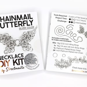 A photo showing the front and back of the silver version of this DIY kit. The front shows a finished butterfly and the material of the jump rings included, anodized aluminum. The back of the booklet shows the project will take 1 to 2 hours and requires two pairs of flat faced pliers (not included). The challenge level for this project is intermediate due to the small nature of the rings.