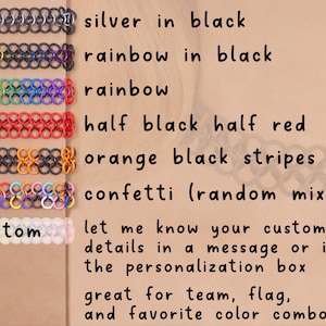 A stack of all the multi color oversized tattoo choker options including: silver in black (the center metal rings are silver and the rubber rings on the edges are black), Rainbow in black, Rainbow, half black half red, orange and black stripes (alternating chunks of orange and black), and confetti (a random mix of colors). Custom necklaces are also available, let me know your custom details in a message or the personalization box. Great for team, flag, and favorite color combos.