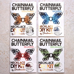 A photo of four of the butterfly kit colors including: Orange monarch, a mostly orange butterfly with black wing tips with white spots. Blue Morpho, a mostly blue butterfly with darker blue to black wingtips. Red Malachite, a mostly red butterfly with black wing tips with white spots. Green Malachite, a butterfly with a mixture of light green and black spread across the wings.