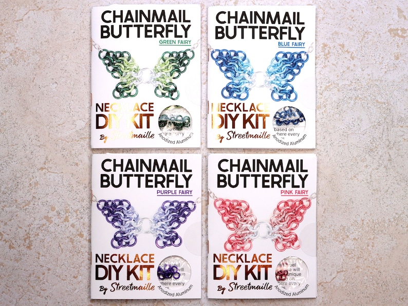 A photo of four of the butterfly kit colors including: Green Fairy, Blue fairy, Purple Fairy, and Pink Fairy. The fairy patterns start with the main color on the wing tip, moving through a lighter version of the color to silver at the center in a pleasant gradient pattern.