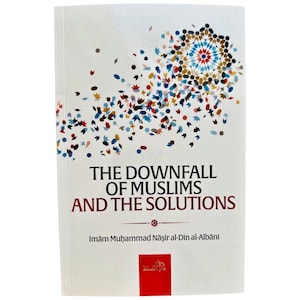 May include: A hardcover book titled "THE DOWNFALL OF MUSLIMS AND THE SOLUTIONS" with the author's name, Imām Muhammad Nāşir al-Din al-Albāni, printed below. The cover features a white background with a colorful geometric design and scattered shapes.