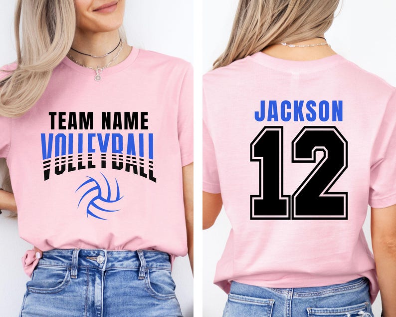 May include: Pink volleyball t-shirt with the words "TEAM NAME VOLLEYBALL" in black and blue. A blue volleyball graphic is below the text. The back of the shirt has the name "JACKSON" and the number "12" in blue and black.