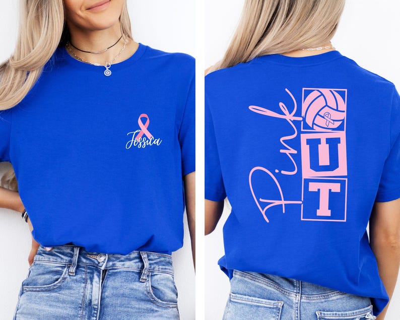 May include: Royal blue t-shirt with a pink ribbon and the name "Jessica" printed on the front. The back of the shirt features the words "Pink UT" with a volleyball graphic in pink. A casual tee for sports fans.
