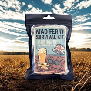 May include: A black, clear-windowed package labeled "MAD FER IT SURVIVAL KIT." The kit features a graphic of a pint of beer, sunglasses, and a Union Jack bucket hat. Text reads "FOR WHEN YOU'RE HALF CUT, DRENCHED IN RAIN, AND STILL NOT GOING HOME."